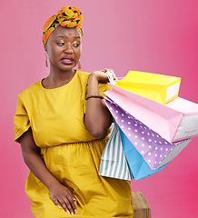 Image showing Studio bag, shopping problem or black woman with bad shop product, boutique crisis or shopaholic. Facial expression, mistake or African customer disappointed with retail present on pink background