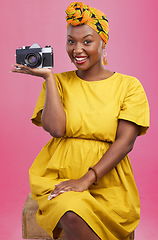 Image showing Camera, photographer portrait and happy black woman for lens photo, profile picture or creative photography, fashion or beauty. Studio photoshoot, happiness or African person smile on pink background