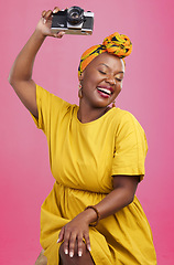 Image showing Studio camera, photographer and happy black woman excited for lens photo, content creation or photography. Creative photoshoot, equipment and talent with African person smile on pink background