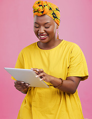 Image showing Black woman, tablet and communication, app and social media with chat, internet search and wireless in studio. Scroll online with smile, African user with tech and touchscreen on pink background