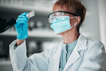 Image showing Microscope slide, woman and research with healthcare, mask and particles with biotechnology, review sample and dna. Person, medical or scientist with face cover, laboratory equipment or data analysis