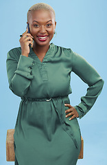 Image showing Phone call, happy and black woman in portrait, talking and listening to contact in studio isolated on a blue background. African person smile on smartphone conversation, speaking and communication.