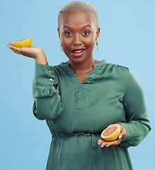 Image showing Black woman, portrait and orange for vitamin C in diet, natural nutrition or detox against a studio background. Happy African female person smile with healthy organic citrus fruit for body wellness