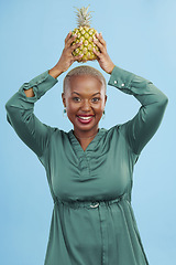 Image showing Portrait, happy and black woman pineapple in studio for detox, lose weight or diet nutrition on blue background. Fruit, face and African lady nutritionist show vegan, lifestyle or organic diet choice