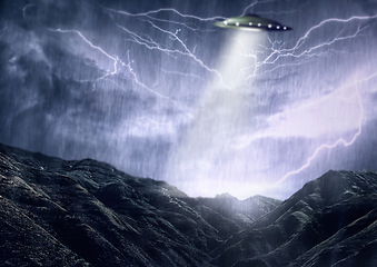 Image showing Alien, spaceship and UFO with lightning on mountain for fantasy, science fiction and space abduction. Extraterrestrial, travel and flying saucer beam in rain for universe discovery, mystery or galaxy