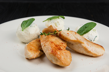 Image showing Grilled chicken breast with mozzarella cheese.