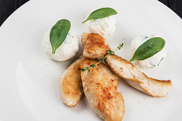 Image showing Grilled chicken breast with mozzarella cheese.