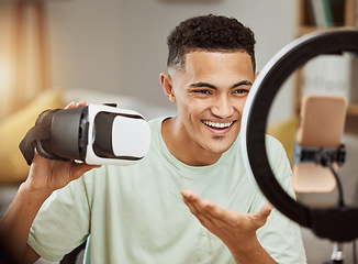 Image showing Ring light, influencer and man with virtual reality headset review in his home live streaming to blog or podcast. Social media, feedback and male gamer with vr goggles for esports, gaming or update