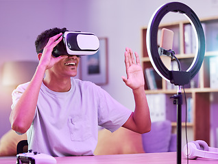 Image showing VR, live streaming and man gamer with future on social media for digital connection in metaverse vlog in a home. Ring light, streamer and content creator or person speaking on internet show as host