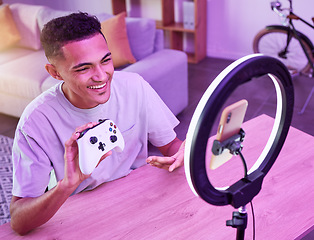 Image showing Review, live streaming and man gamer talking of console controller on social media for connection on vlog. Ring light, influencer and content creator or person speaking on internet show as host