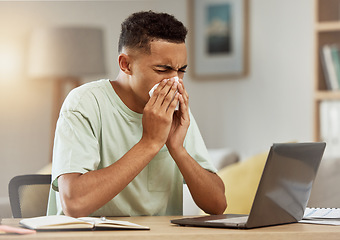 Image showing Sneeze, man and tissue in living room with flu, virus or cough while learning online at home. Health, person and fever blow nose with tissue from influenza, illness or cold by table in apartment