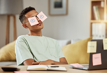 Image showing Education, sticky notes and a man student sleeping at his desk in the bedroom while learning for school. Burnout, tired and exhausted with a young university or college pupil asleep in his home