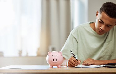 Image showing Piggy bank, finance and man with budget, writing and savings with bills, planning and future at home. Money management, growth and investment, financial strategy with notes and wealth in account