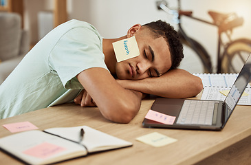 Image showing Sleeping, laptop and tired business man in office with paper, research or note on face at desk for nap. Work, burnout and guy designer with insomnia, low energy or boring online task, lazy or fatigue