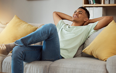 Image showing Relax, calm and man in a sofa happy, chilling and enjoy weekend freedom at home. Resting, peace and male person in a living room with break, day off or weekend me time, smile and stress free in house