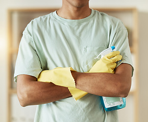 Image showing Man, hands and spray bottle in housekeeping, cleaning or bacteria and germ removal at home. Closeup of male person, maid or cleaner with arms crossed of professional in domestic service at house