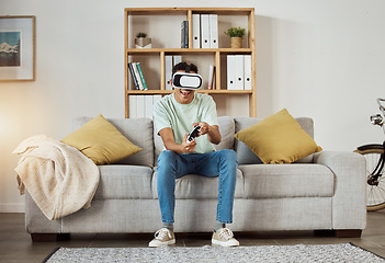 Image showing Virtual reality glasses, relax and man with game, controller and connection with software, smile or internet. Person, gamer or guy on a sofa, VR eyewear or geek with online playing, home or metaverse