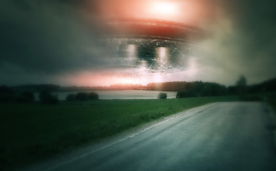 Image showing UFO, spaceship and countryside with alien in sky for fantasy or science fiction event in nature, field or landscape with clouds. Earth, aliens and extraterrestrial drone in environment with blur