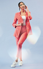 Image showing Fashion, beauty and woman in portrait with suit, makeup and confidence with lens flare. Beauty, style and influencer girl in designer clothes, trendy promo and model standing on blue background.