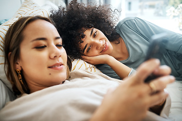 Image showing Phone, social media and an lgbt couple in bed together in the morning for communication or to relax. Love, lesbian and a woman watching a movie or video with her girlfriend in the home bedroom