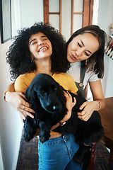 Image showing Dog, hug and happy lesbian couple in home, bonding or having fun together. Pet, gay women smile and embrace animal for care in healthy relationship, love connection and funny laugh of lgbtq people