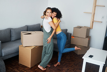 Image showing Lesbian, couple and hug with moving, boxes and excited with happiness for investment in apartment or property. Happy, people and women together with love and celebration of new home together