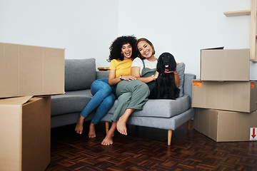 Image showing New home, portrait and lesbian couple with a dog on the sofa for moving boxes and relocation. Smile, lgbt and women or people on the living room couch of an apartment with a pet and a homeowner