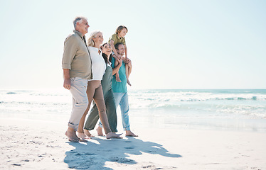 Image showing Walking, beach and big family together on vacation, holiday or tropical weekend trip with love. Happy, travel and child with parents and grandparents bonding by ocean or sea on adventure in Australia