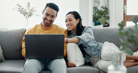 Image showing Couple, laptop and laugh on sofa in home for love, watch movies and streaming multimedia. Happy man, woman and talk about funny meme on computer, social media post and online shopping in living room
