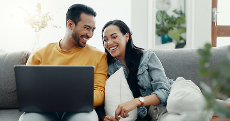 Image showing Couple, laptop and laugh on sofa in home for love, watch movies and streaming multimedia. Happy man, woman and talk about funny meme on computer, social media post and online shopping in living room