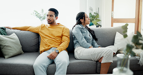 Image showing Unhappy, fight and couple angry on a couch together duo to infertility, argument and toxic relationship in a home. Conflict, divorce and man has problem with woman in a living room sofa for cheating