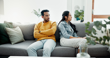 Image showing Conflict, fight and couple angry on a couch together duo to infertility, argument and toxic relationship in a home. Unhappy, divorce and man has problem with woman in a living room sofa for cheating