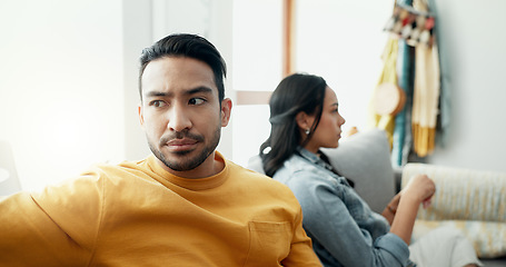 Image showing Couple, fight and angry in home for divorce, breakup and ignore partner in bad argument on sofa. Asian man, woman and thinking of stress, conflict and drama of cheating, mistake or toxic relationship