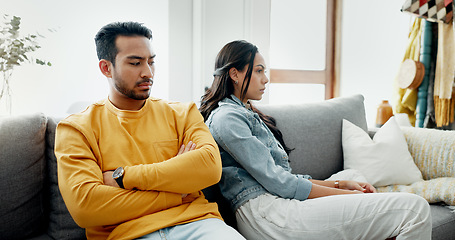 Image showing Conflict, fight and couple angry on a couch together duo to infertility, argument and toxic relationship in a home. Unhappy, divorce and man has problem with woman in a living room sofa for cheating