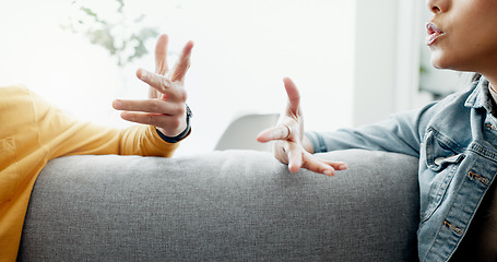 Image showing Argument, hands and closeup of couple on a sofa in the living room for cheating, fight or toxic relationship. Conversation, discussion and zoom of man and woman talking for communication at home.