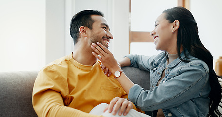 Image showing Conversation, funny and couple on sofa in home living room, bonding and having fun. Smile, communication of man and woman in lounge for healthy connection of love, happy or laughing together in house