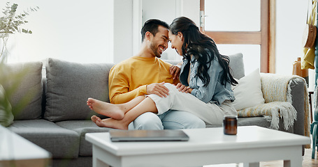 Image showing Couple, relax and romance on sofa, talk and happy in home living room, bonding and funny joke. Man, woman and smile together with intimate chat, care and comic conversation on lounge couch in house