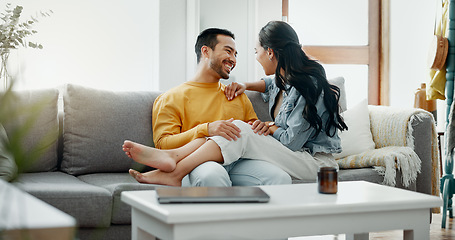 Image showing Couple, happy and talking on home sofa with a smile, security and love in healthy relationship. Young man and woman together in living room for affection, forehead touch and communication with care