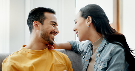 Image showing Conversation, funny and couple on sofa in home living room, bonding and having fun. Smile, communication of man and woman in lounge for healthy connection of love, happy or laughing together in house