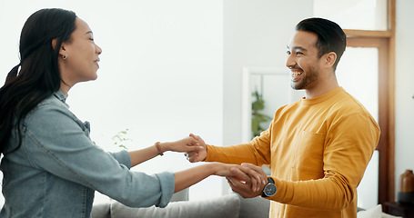 Image showing Couple, dancing in living room and love, bonding and happy people together at home. Healthy relationship, trust and support in commitment, partner and marriage, romance and intimacy with laughter