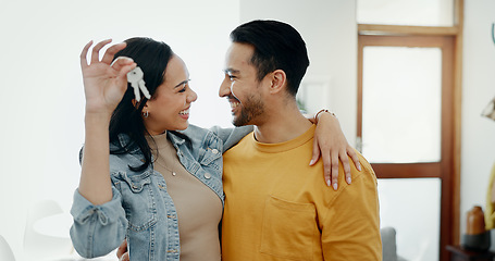 Image showing Love, keys and smile with couple in new house for moving, real estate and investment. Property, excited and future with portrait of man and woman at home for opportunity, success or marriage together