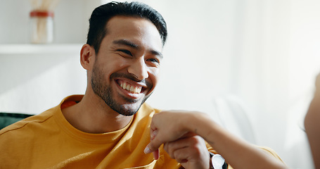 Image showing Holding hands, smile and couple on a sofa, relax and bond with conversation, romance and care at home. Happy, love and man in a living room with trust, support and smile while speaking in a house