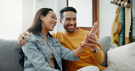 Image showing Couple, engagement ring and relax on sofa, talk and happy in home living room, bonding or kiss cheek. Man, woman and smile with for planning, marriage and future together with care on couch in house
