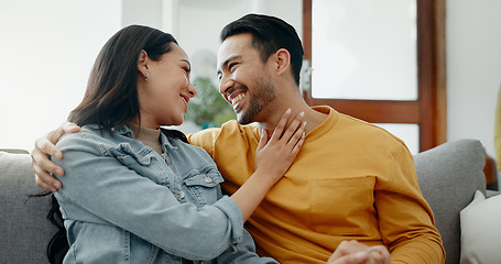 Image showing Conversation, funny and couple on sofa in home living room, bonding and having fun. Smile, communication of man and woman in lounge for healthy connection of love, happy or laughing together in house