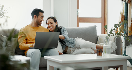 Image showing Couple, laptop and laugh on sofa in home for meme, watch movies and streaming funny multimedia. Happy man, woman and relax at computer in living room on social media, web subscription or comedy show