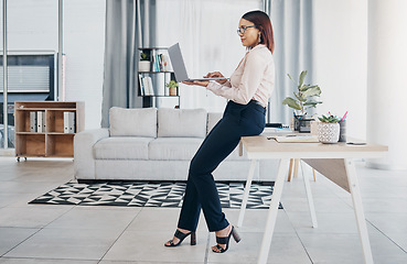 Image showing Woman in modern office with glasses, laptop and reading email, HR schedule and online report feedback. Website, networking or communication on digital app, businesswoman at human resources agency
