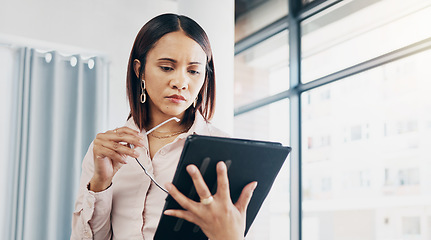 Image showing Woman in office, reading and thinking with tablet for email, HR schedule or report online for feedback. Research, networking and communication on digital app, businesswoman at human resources agency.