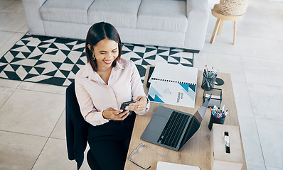 Image showing Smartphone, smile and business woman at table in home living room on social media, internet search and freelancer typing. Designer on phone at desk, reading email and communication for remote work