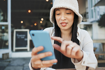 Image showing Travel, student and woman with phone at a cafe for social media, texting or chatting in a city. Smartphone, app and lady influencer at coffee shop for content creation, podcast or traveling blog post