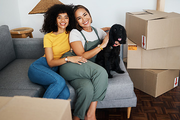 Image showing Homeowner, portrait and lesbian couple with a dog on the sofa for moving boxes and a new home. Smile, lgbt and women or people on the living room couch of an apartment with a pet after relocation